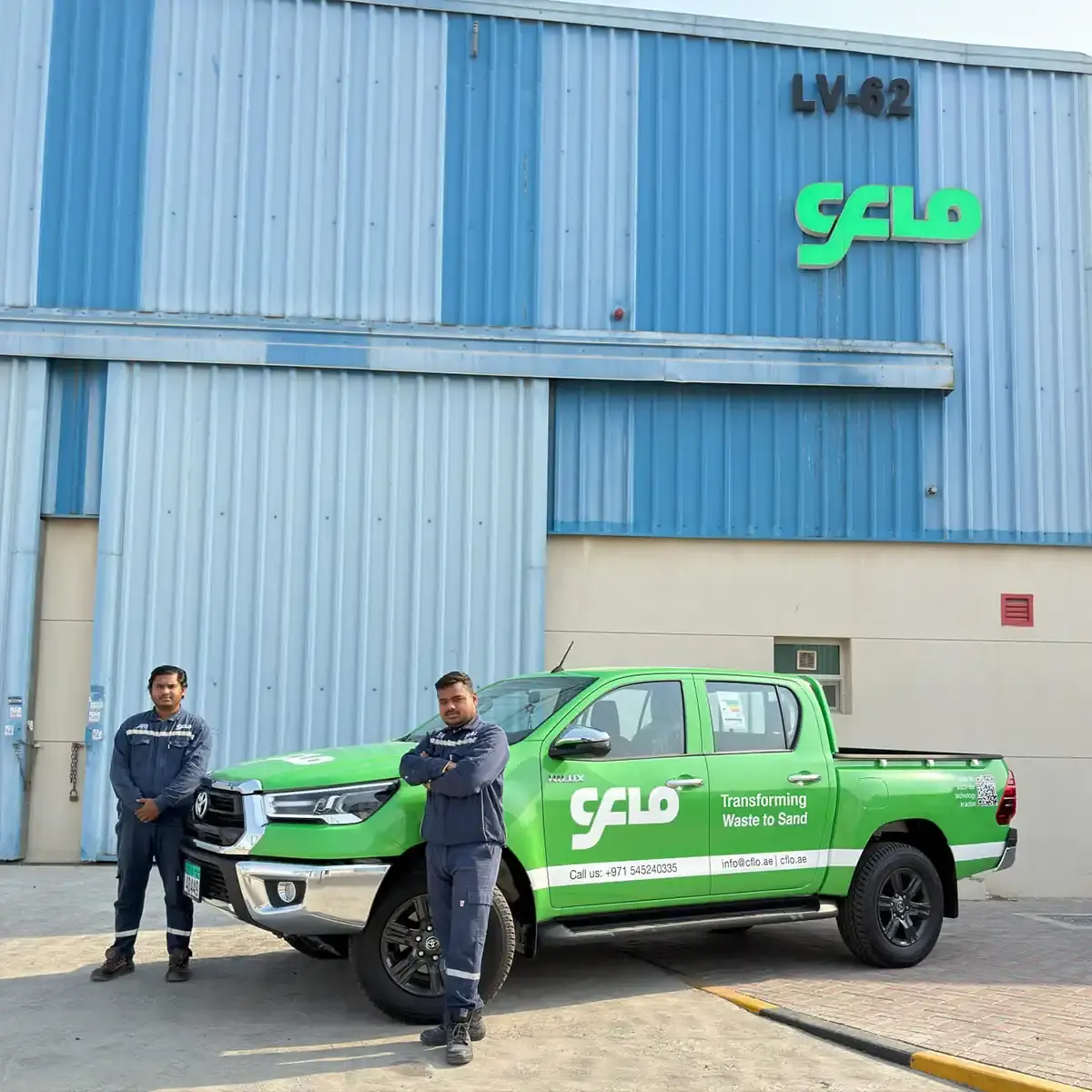CFlo service pickup and two technicians outside the CFlo World FZE service hub in the Hamriyah Free Zone, Sharjah