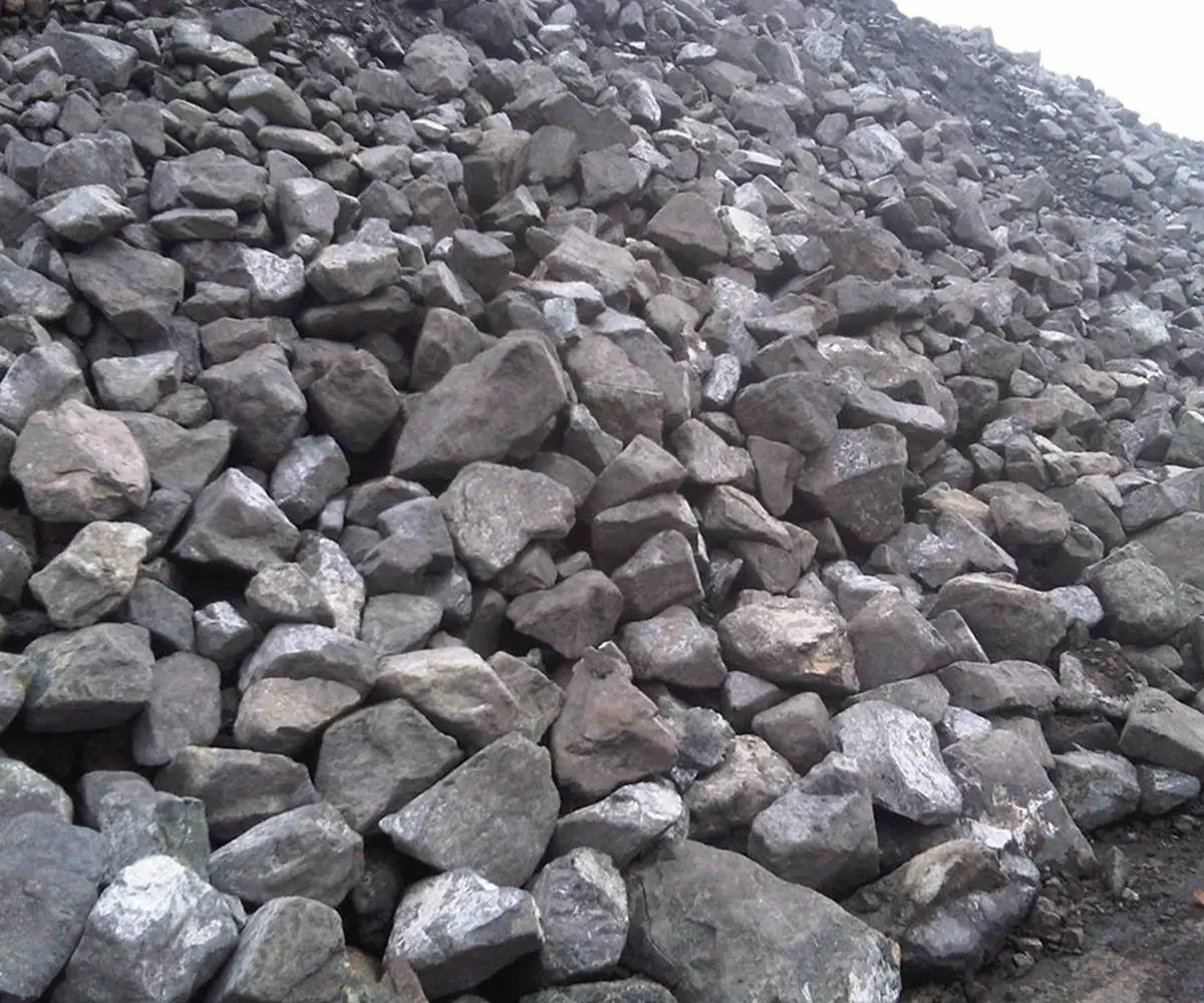 Close-up of coarse grey chromite ore lumps