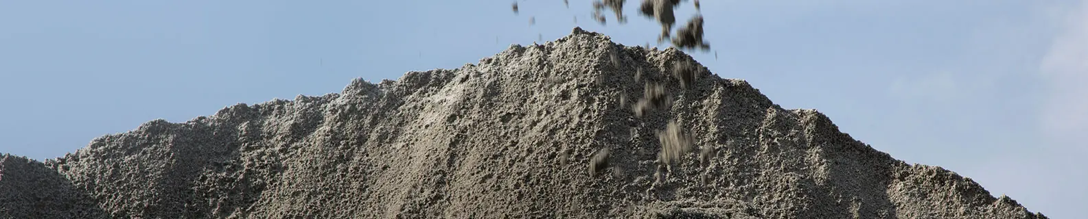 A heap of manufactured sand with a coarse, angular surface